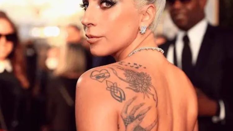 Following Her Moving Oscars Performance Of &Quot;'Til It Happens To You,&Quot; Lady Gaga Got A Symbol Of Unity Tattooed On Her Shoulder (Below The Heart)