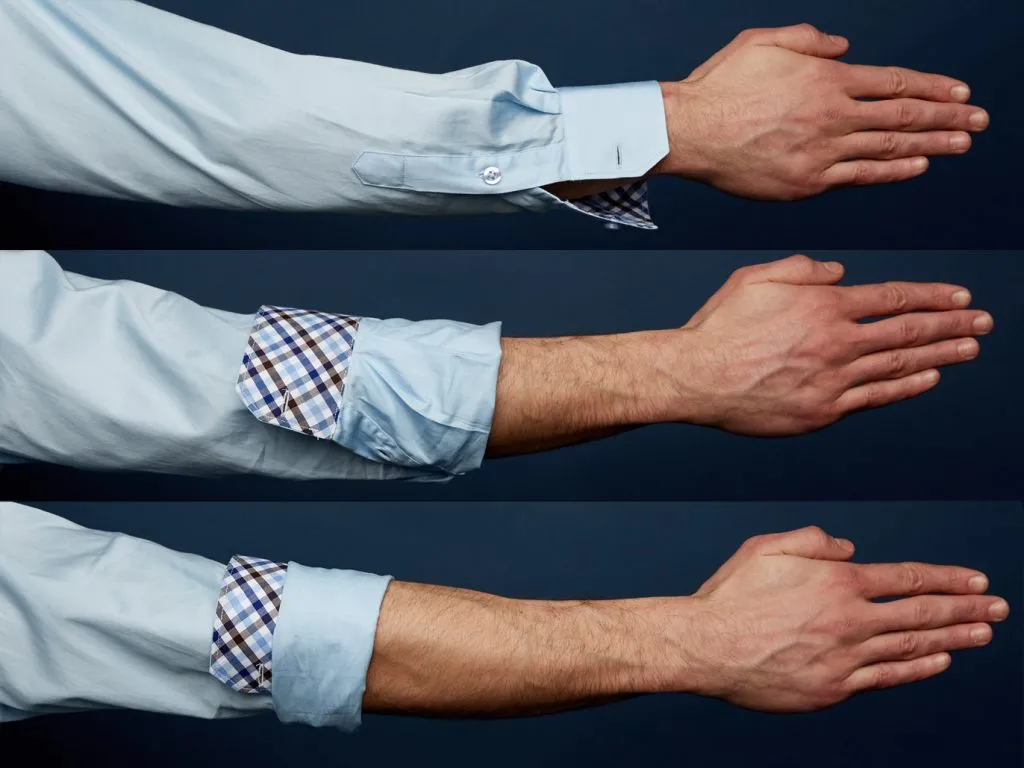 Unbutton The Cuff And The Gauntlet (The Little Button Halfway Up The Sleeve). Fold The Cuff Inside Out To Just Below The Elbow. Then, Fold The Bottom Of The Sleeve Up To Cover The Cuff, Leaving Only The Top Edge Of The Cuff Exposed. 